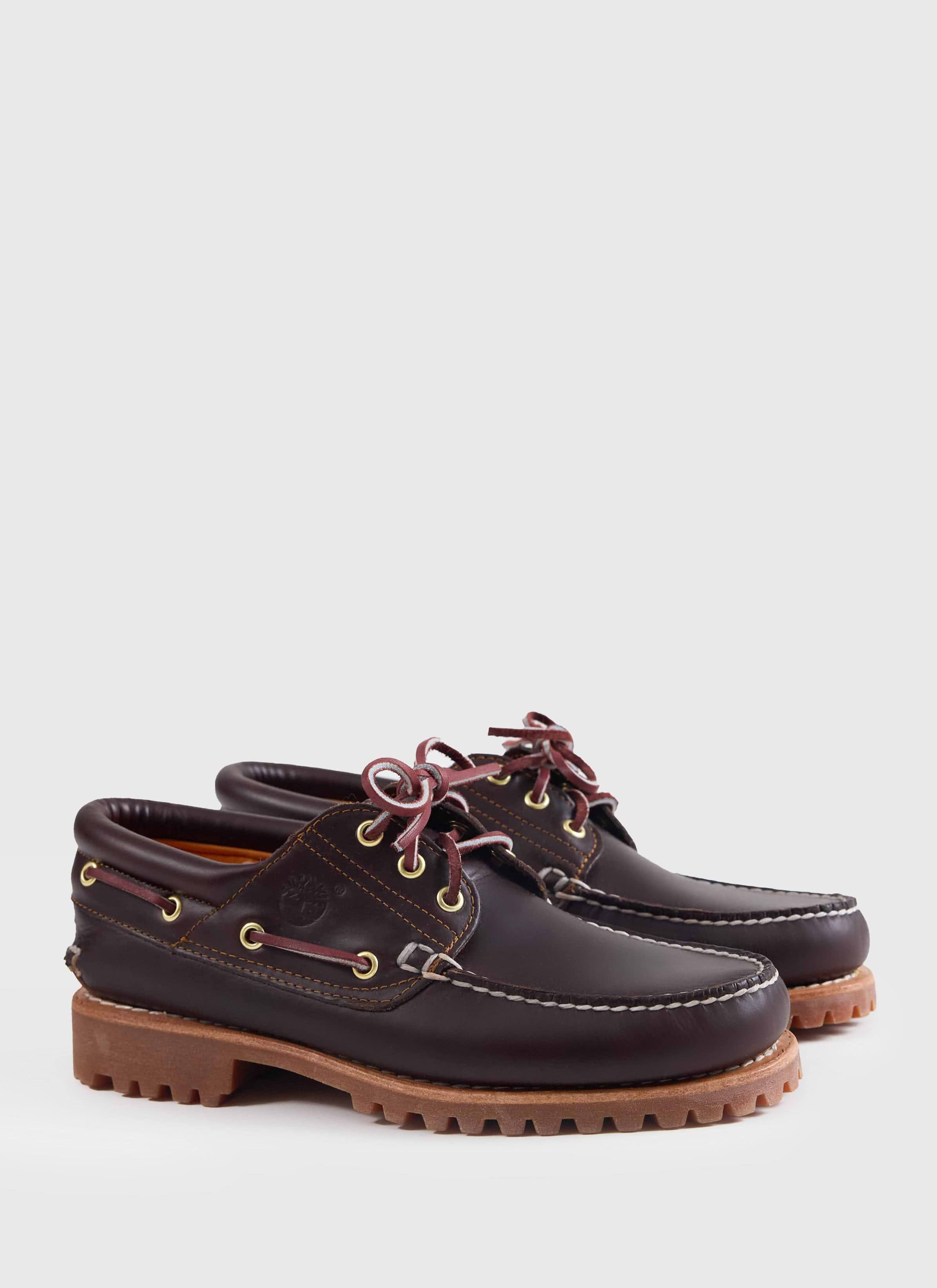 A side view of the brown Timberland Authentic Boat Shoe at Percival, featuring handsewn leather and a rugged lug sole.