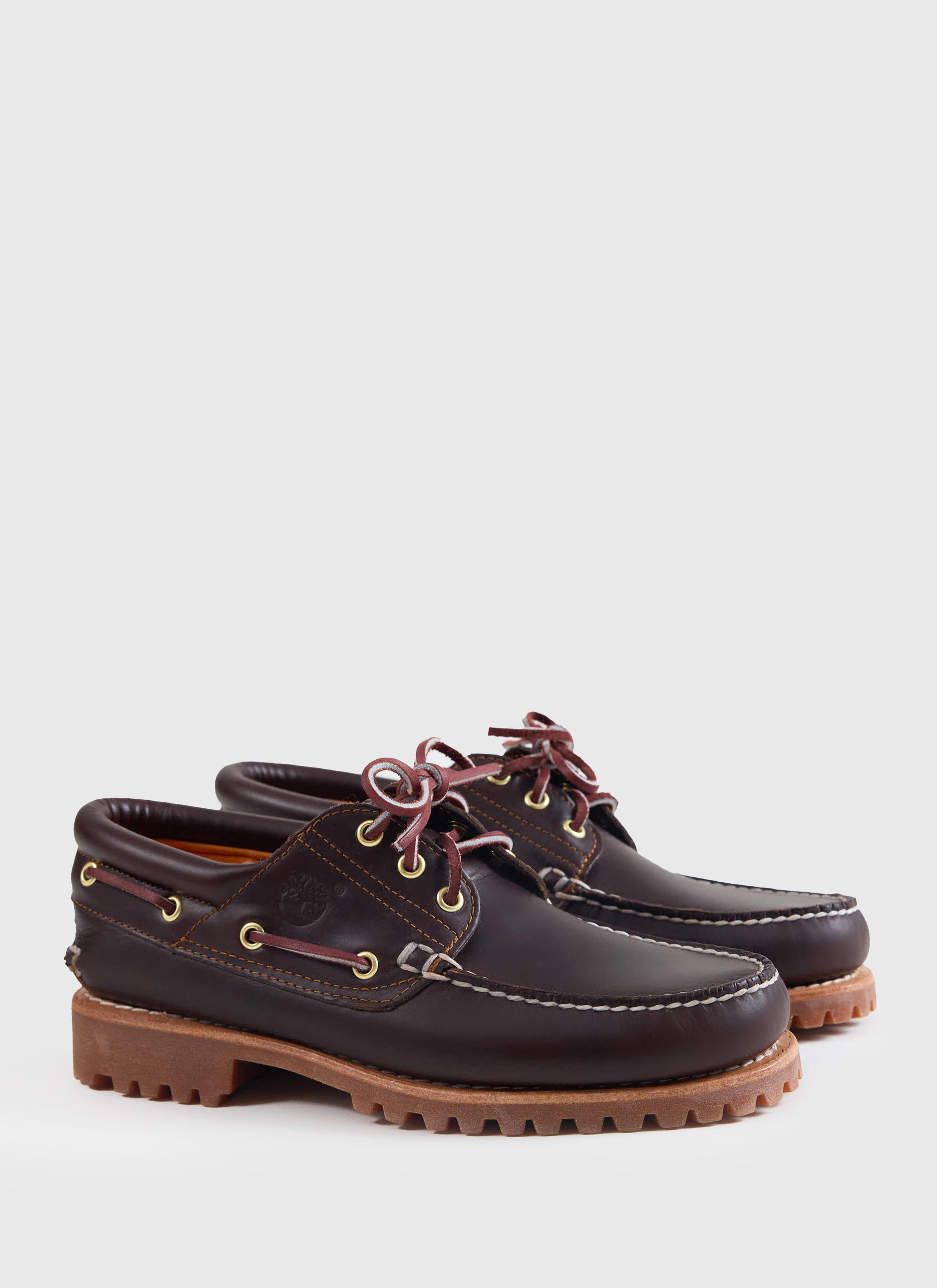 A side view of the brown Timberland Authentic Boat Shoe at Percival, featuring handsewn leather and a rugged lug sole.