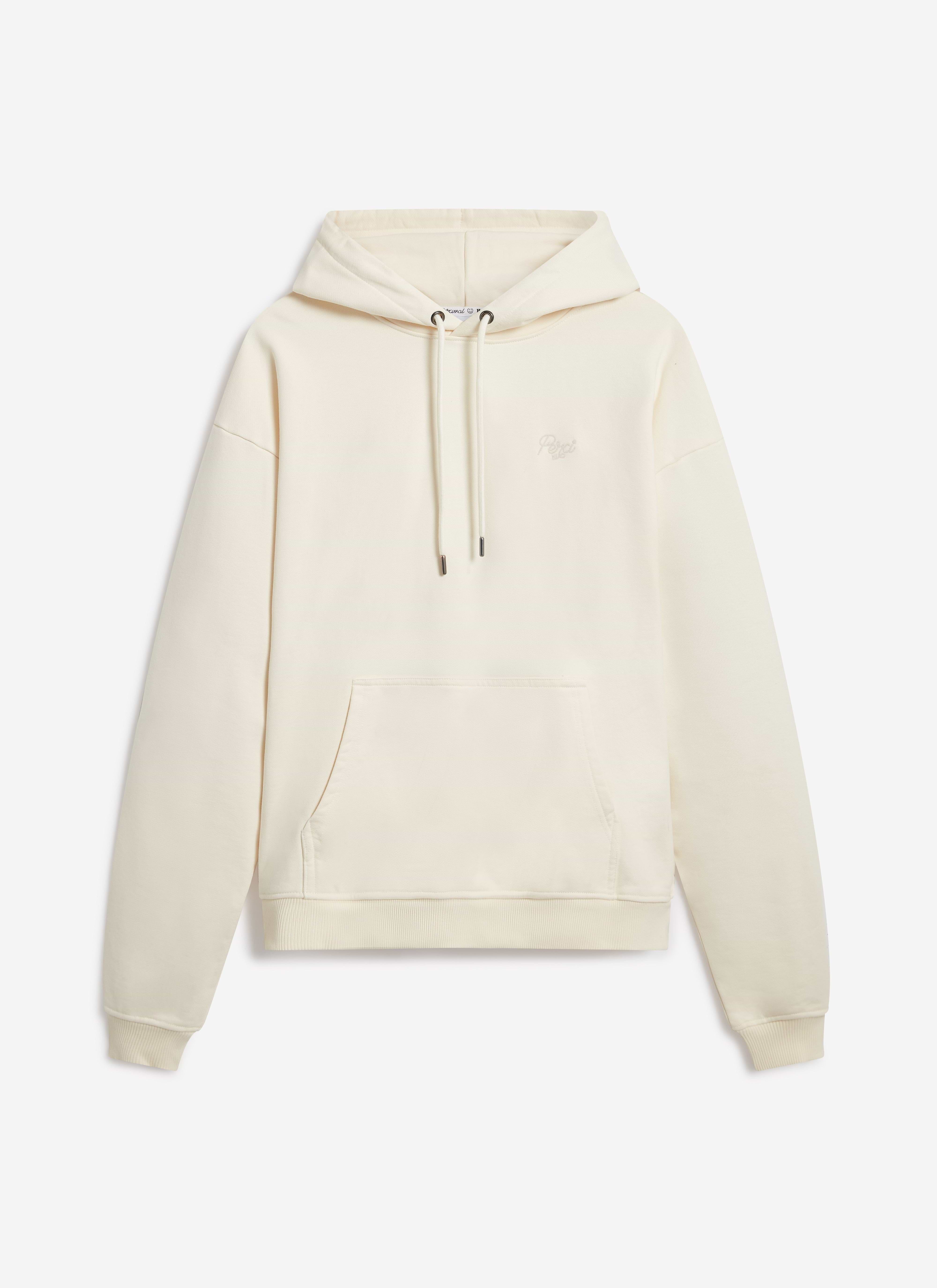 The Percival Perci Chainstitch Hoodie in ecru cotton, laid flat to show the front view and tonal chest embroidery.