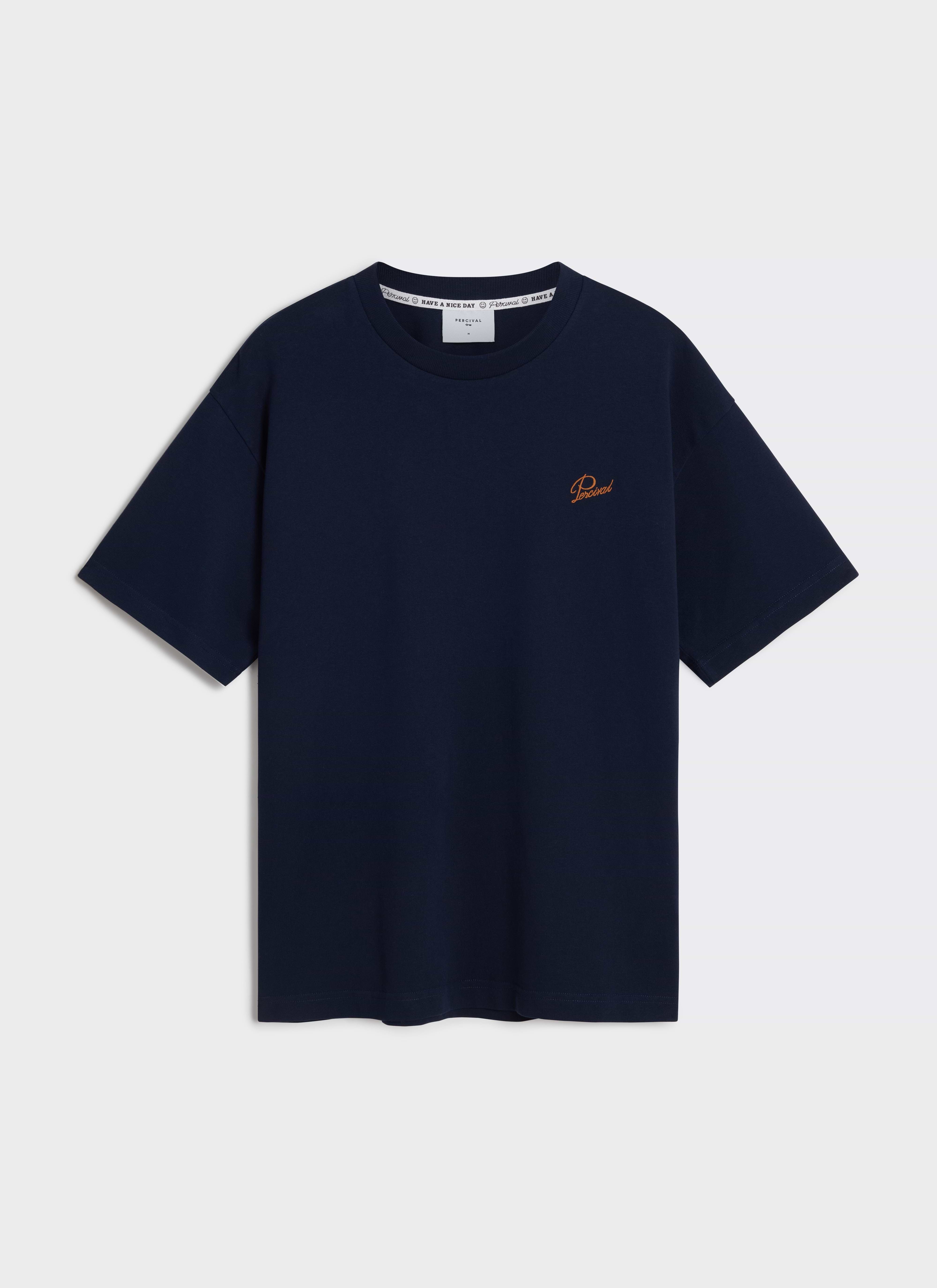A flat lay of the navy organic cotton Perci Script T Shirt by Percival, showing the orange embroidered chest script.