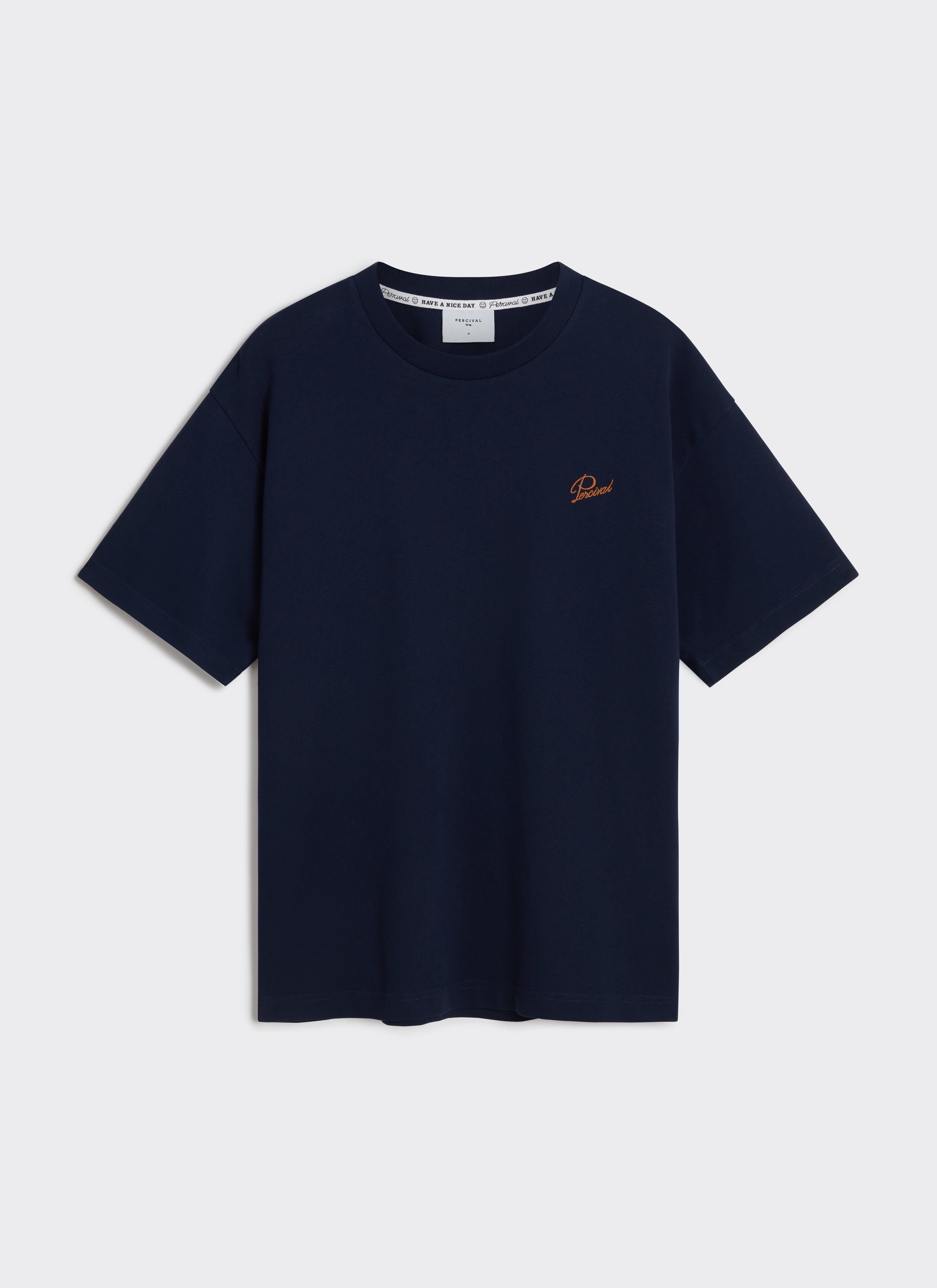 A flat lay of the navy organic cotton Perci Script T Shirt by Percival, showing the orange embroidered chest script.