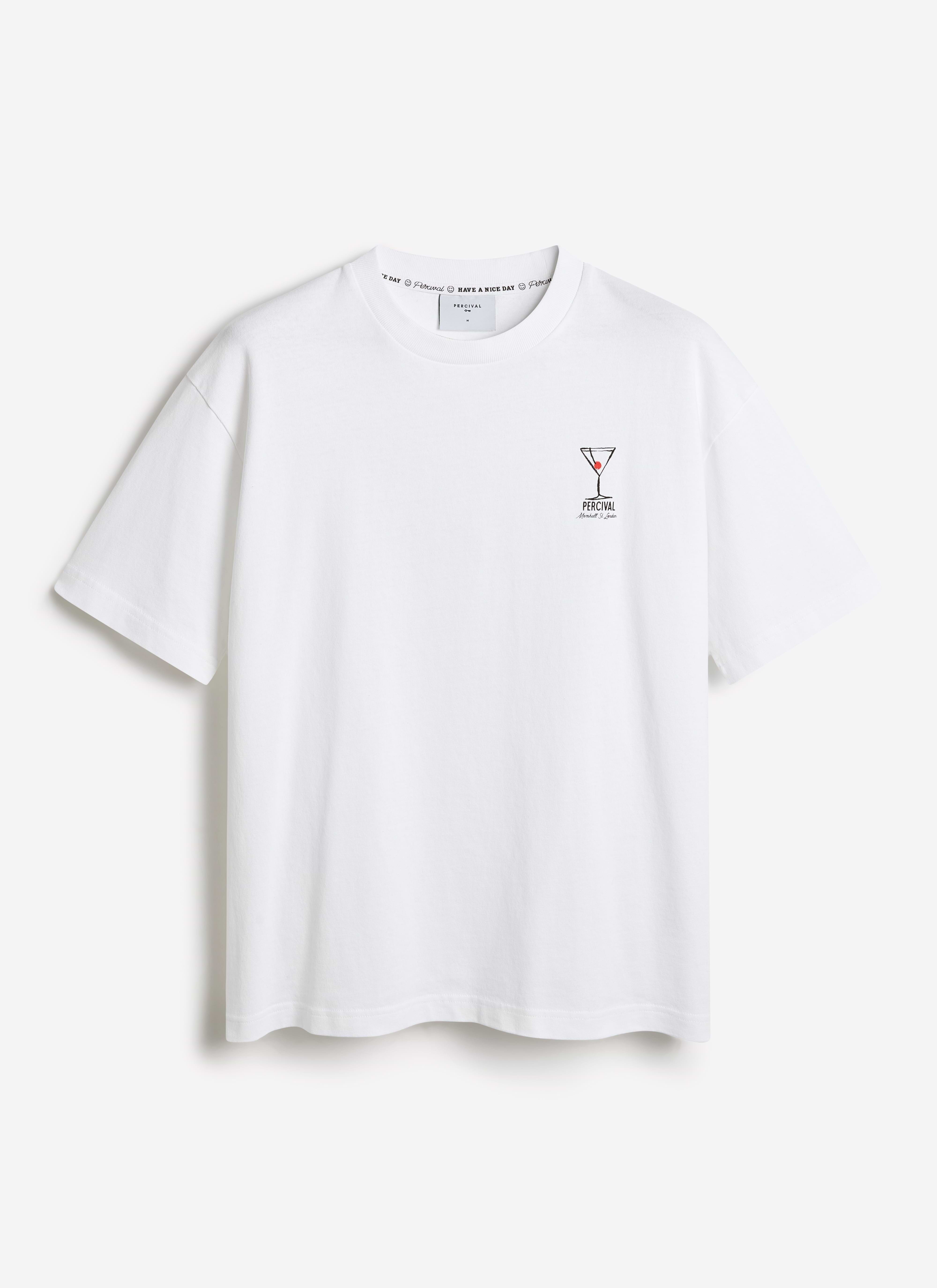 White organic cotton oversized t-shirt by Percival featuring a small martini glass illustration on the chest.
