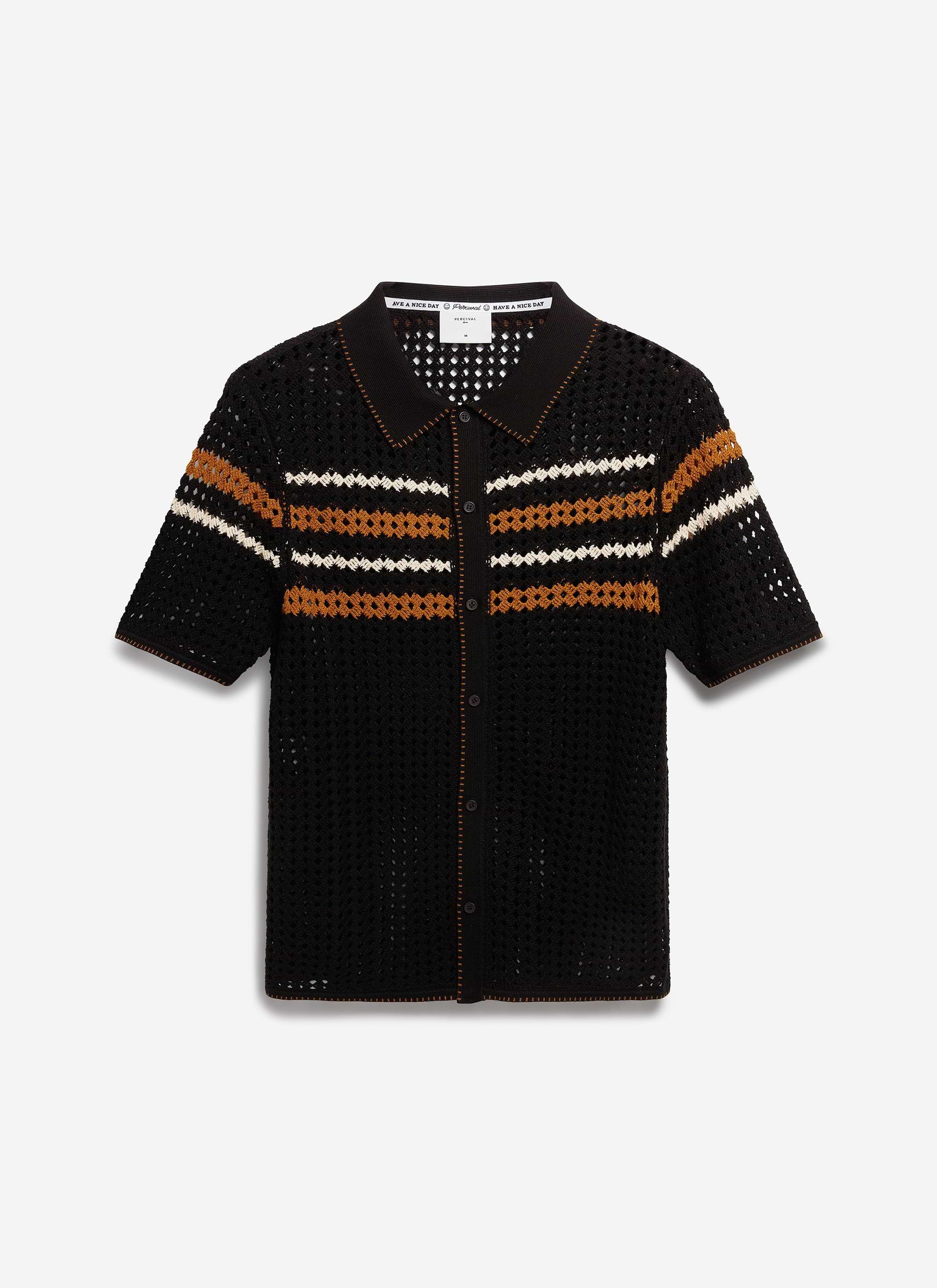 The Percival Pesaro Knitted Shirt in black cotton, laid flat to show the crochet design and striped chest detail.