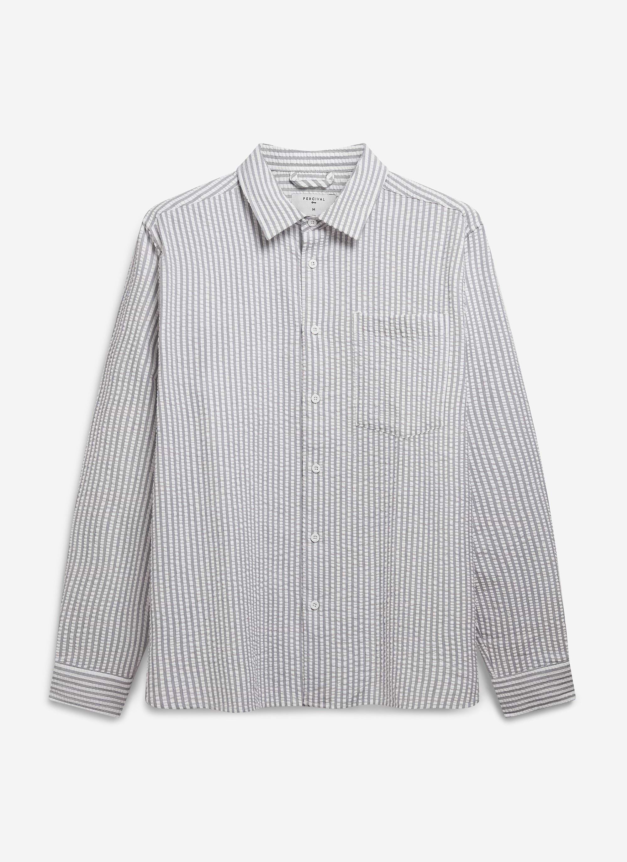 The Percival Seersucker Stripe Pearce Shirt in grey, laid flat to show its point collar, breast pocket and textured fabric.