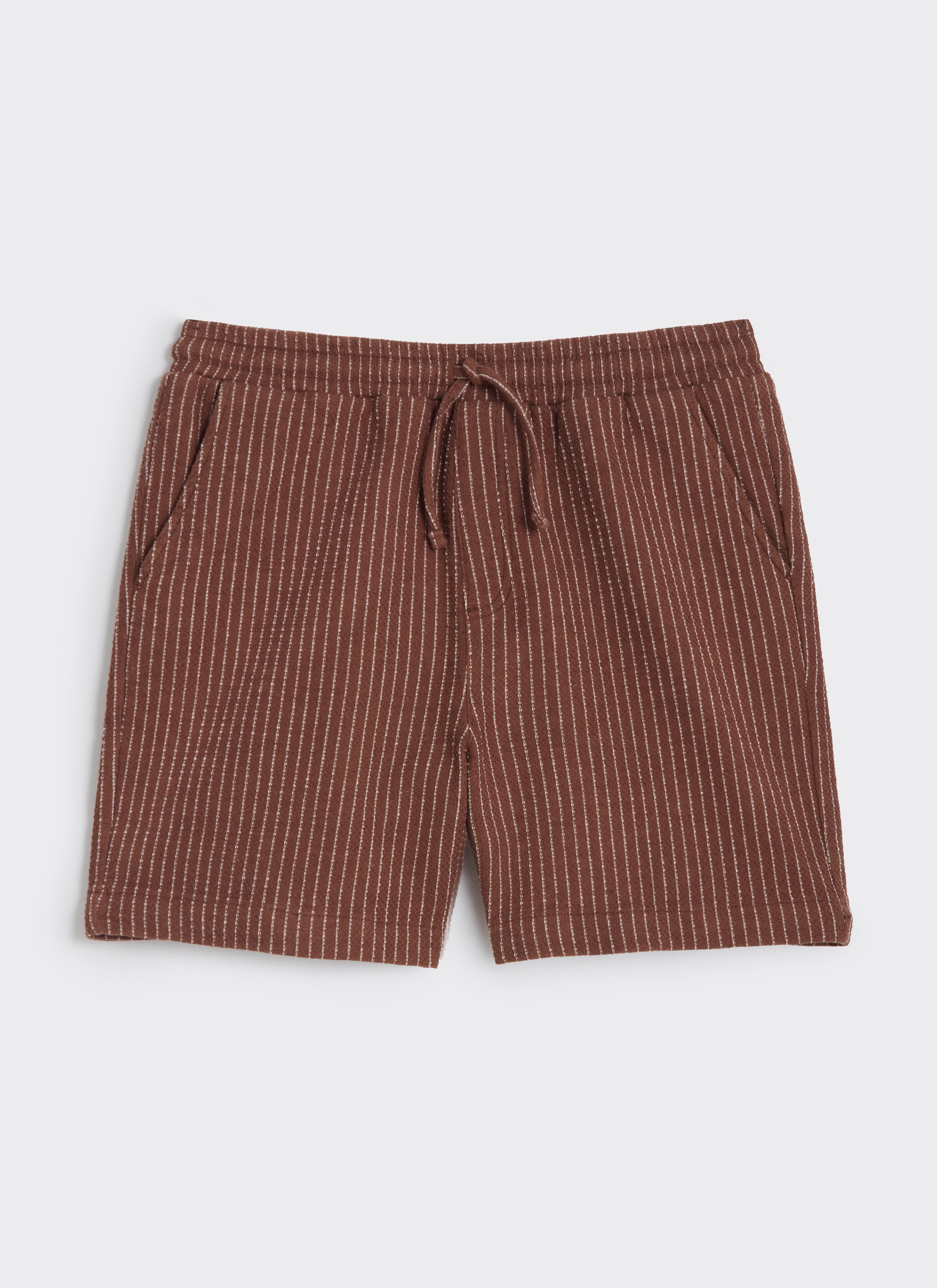 A flat lay of the Percival Sorrento Straight Leg Shorts in brown linen-blend, featuring a white vertical pinstripe pattern.