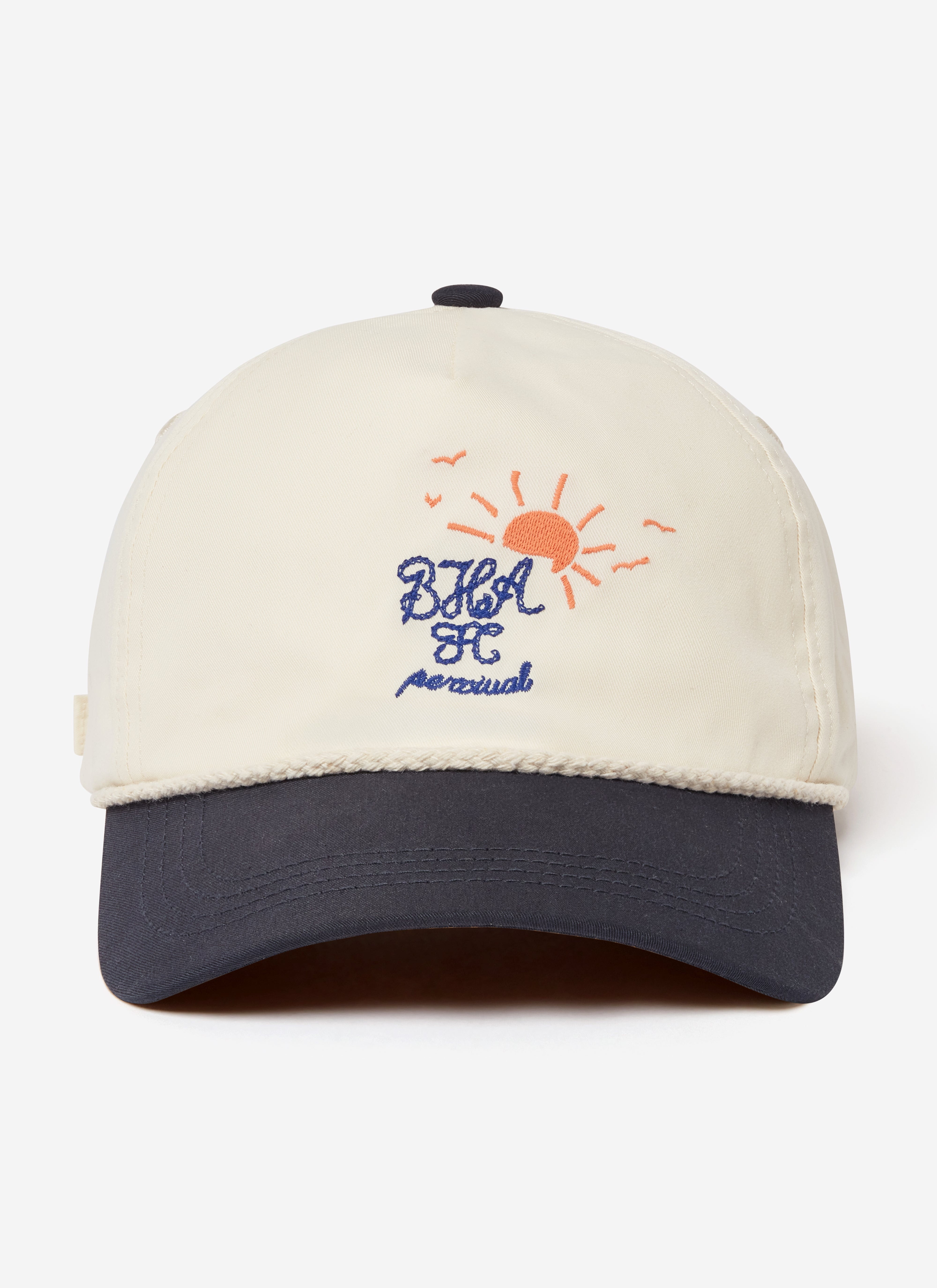 A front view of the cream Percival x Brighton & Hove Albion F.C. trucker cap, featuring a navy peak and sun embroidery.