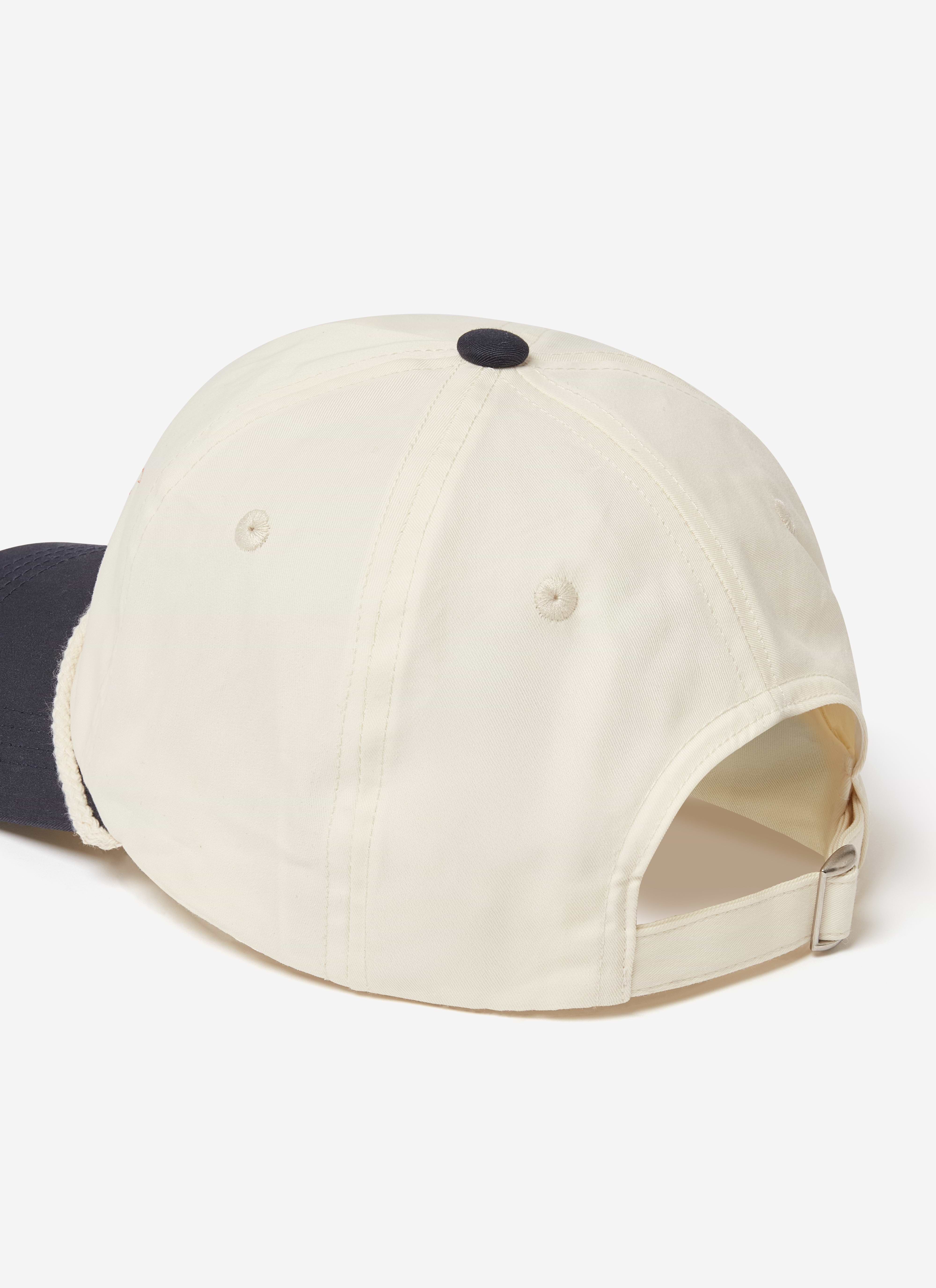 Back view of the Brighton & Hove Albion F.C. x Percival trucker cap in cream, showing the adjustable strap.