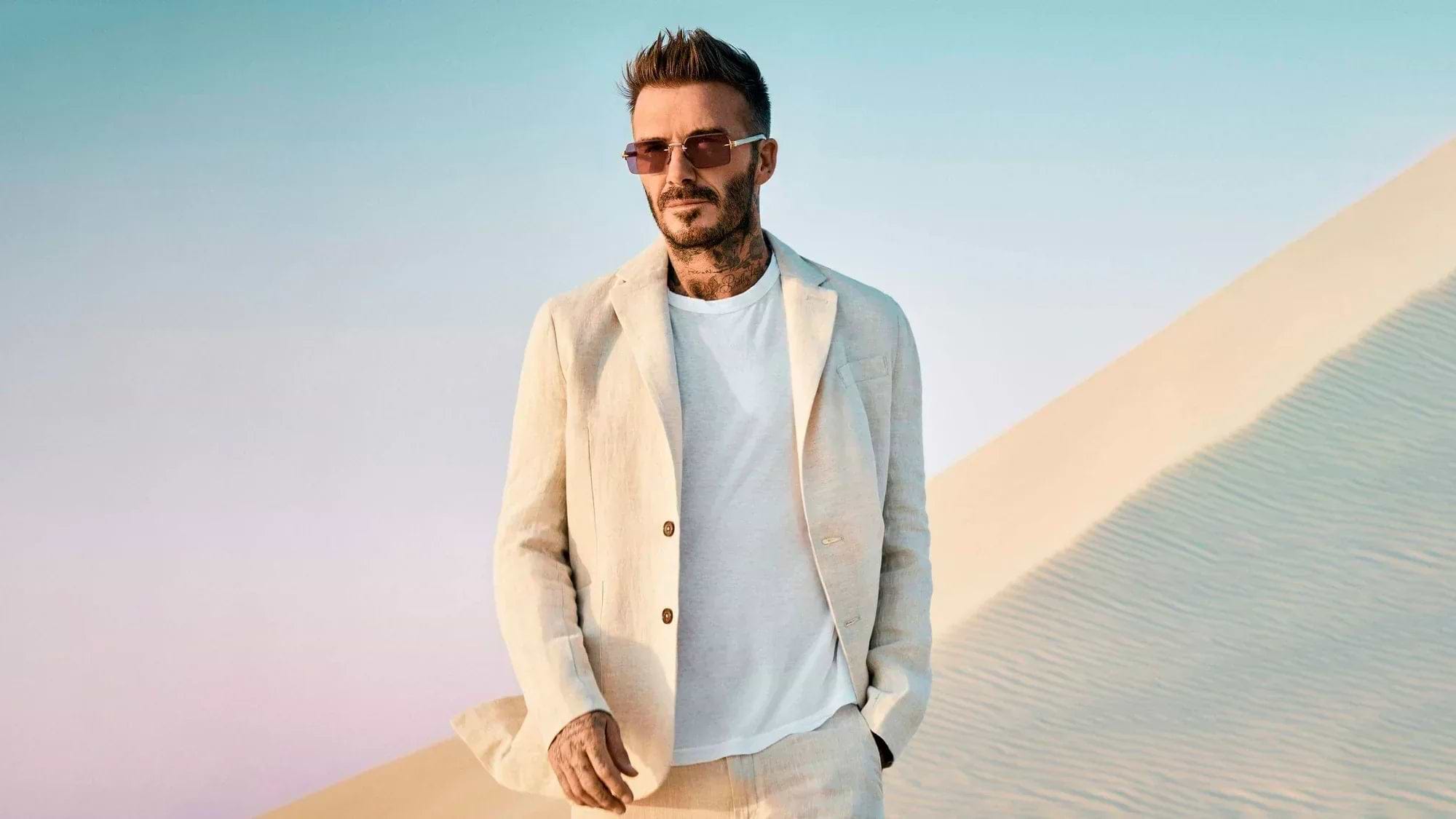 David Beckham wearing a cream linen two-piece suit by Percival Menswear.