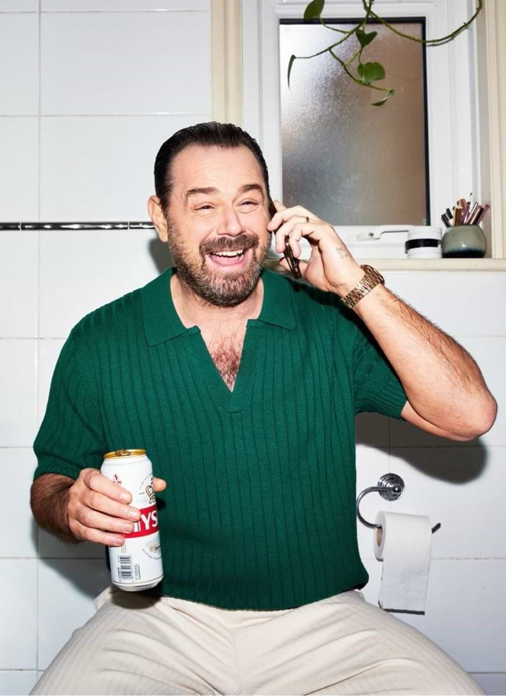 Danny Dyer wearing forest green knitted polo shirt by Percival Menswear