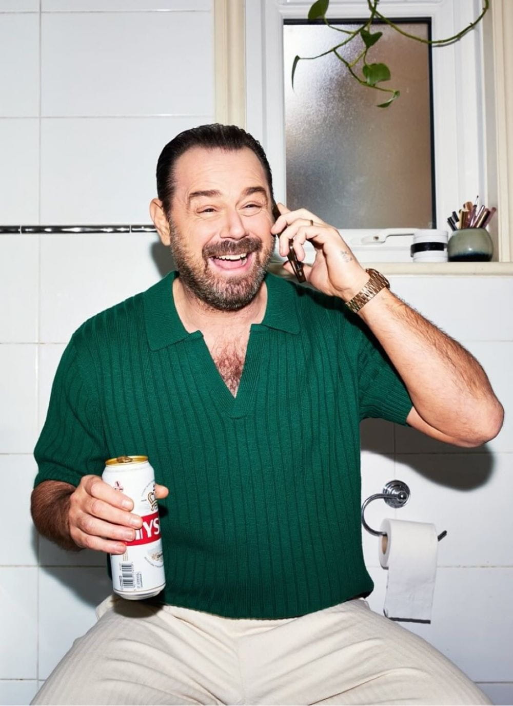 Danny Dyer wearing forest green knitted polo shirt by Percival Menswear