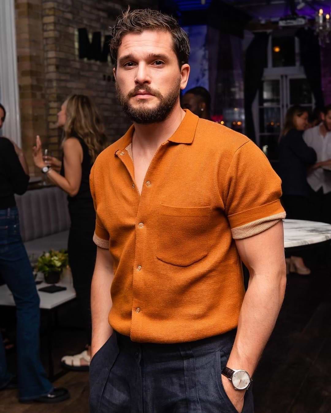 Kit Harrington wearing Percival Menswear orange knitted shirt