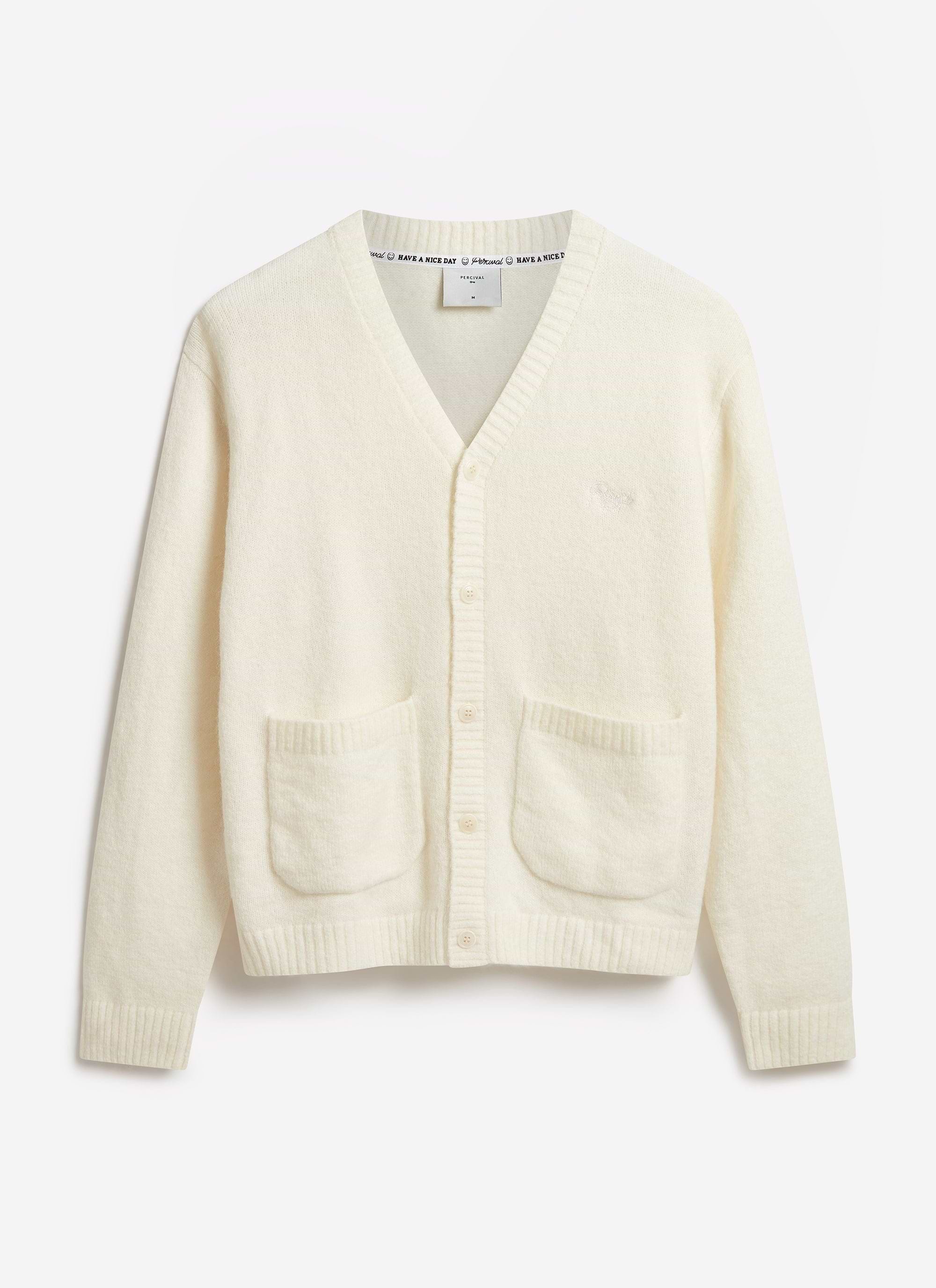 The Percival White Glove Cardigan in ecru, a soft mohair-blend knit, laid flat against a white background.