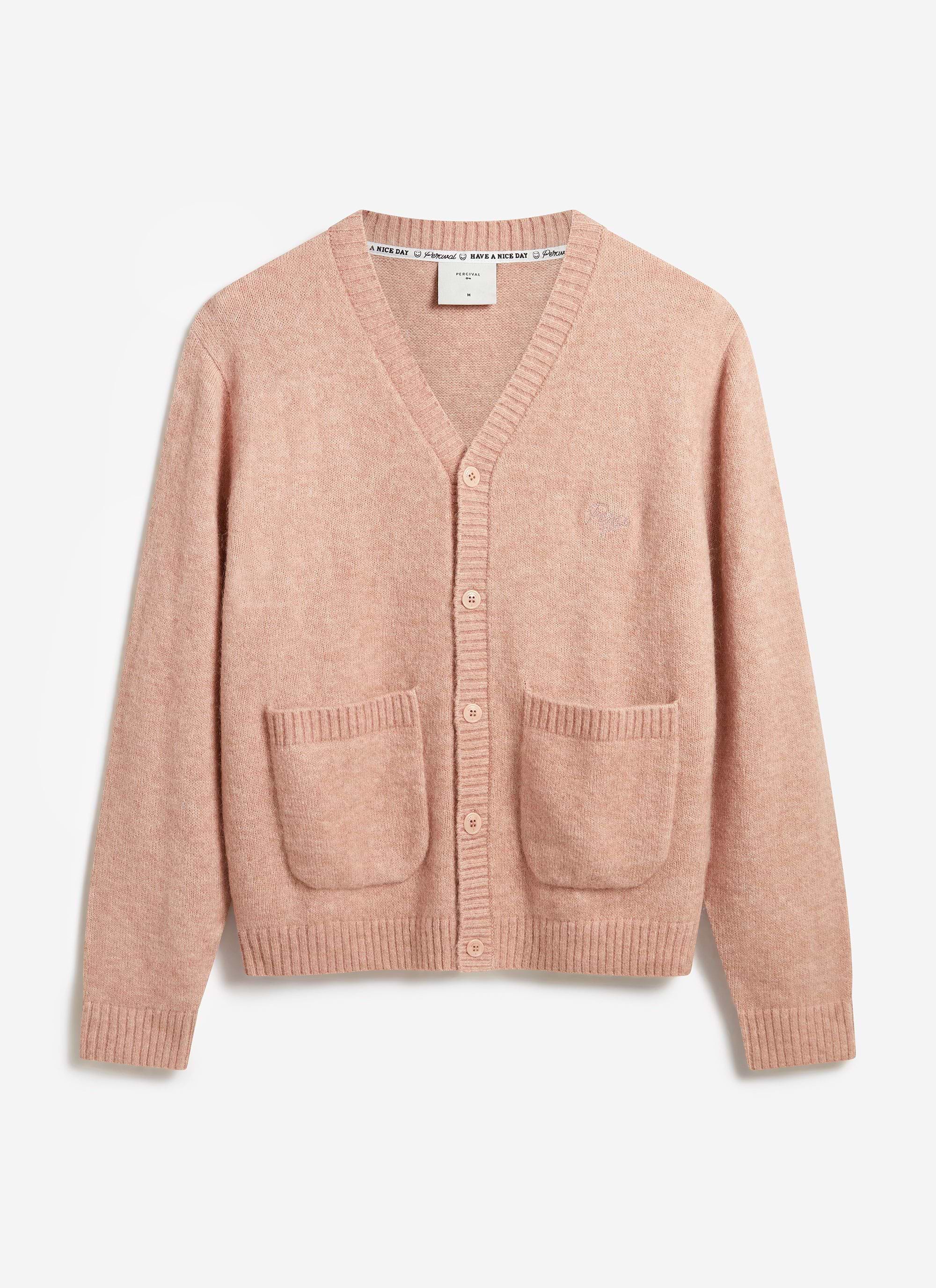 The Percival White Glove Cardigan in pink mohair, laid flat to show its v-neck, patch pockets and tonal embroidery.