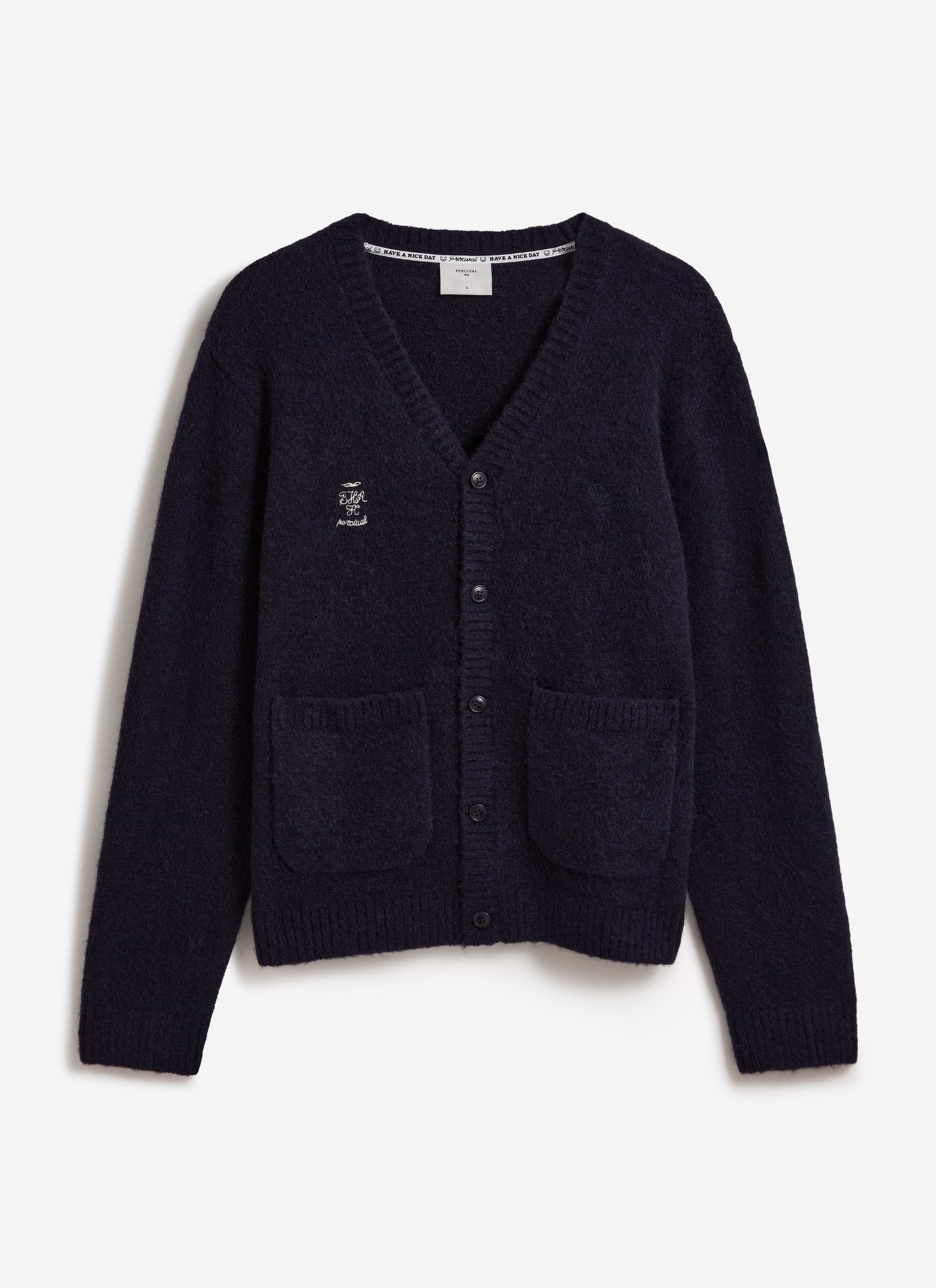 A front view of the navy White Glove Cardigan by Percival x Brighton & Hove Albion F.C. with white chest embroidery.