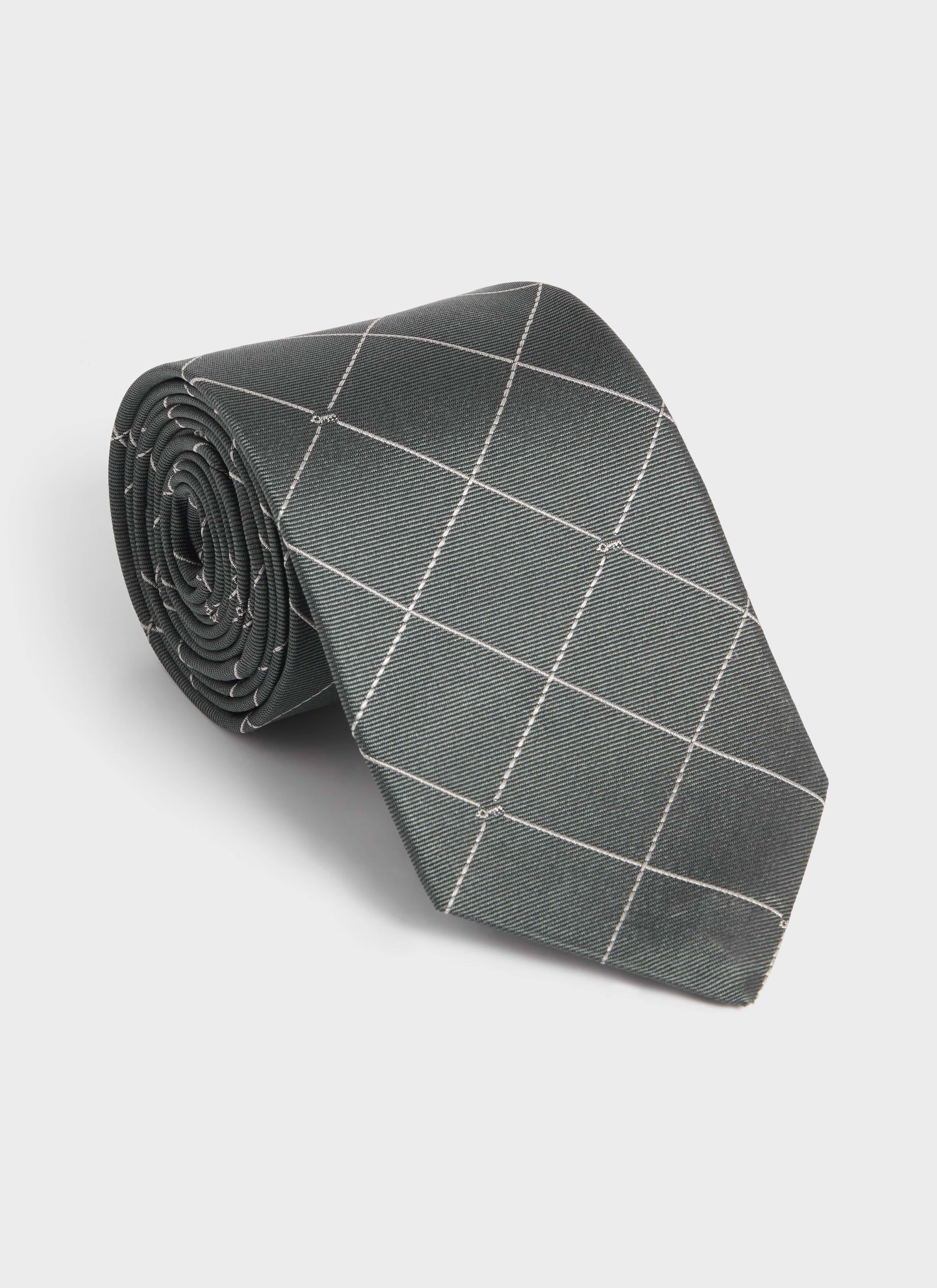 Rolled forest green silk Percival Window Pane Key Jacquard Tie showcasing the white grid and key detail pattern.