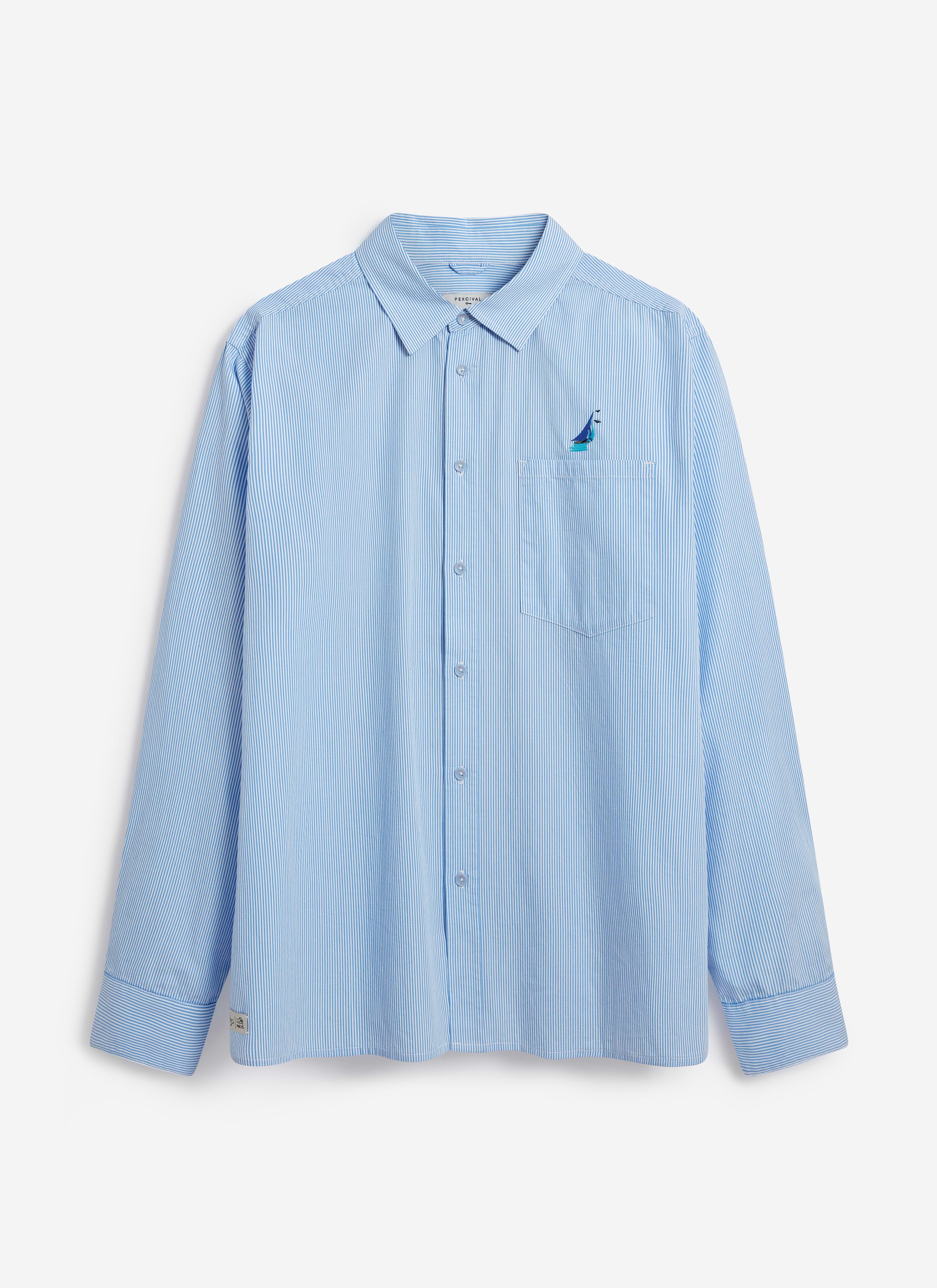 The Percival Yacht Stripe Oversized Shirt in blue cotton, laid flat to showcase the front and yacht embroidery.