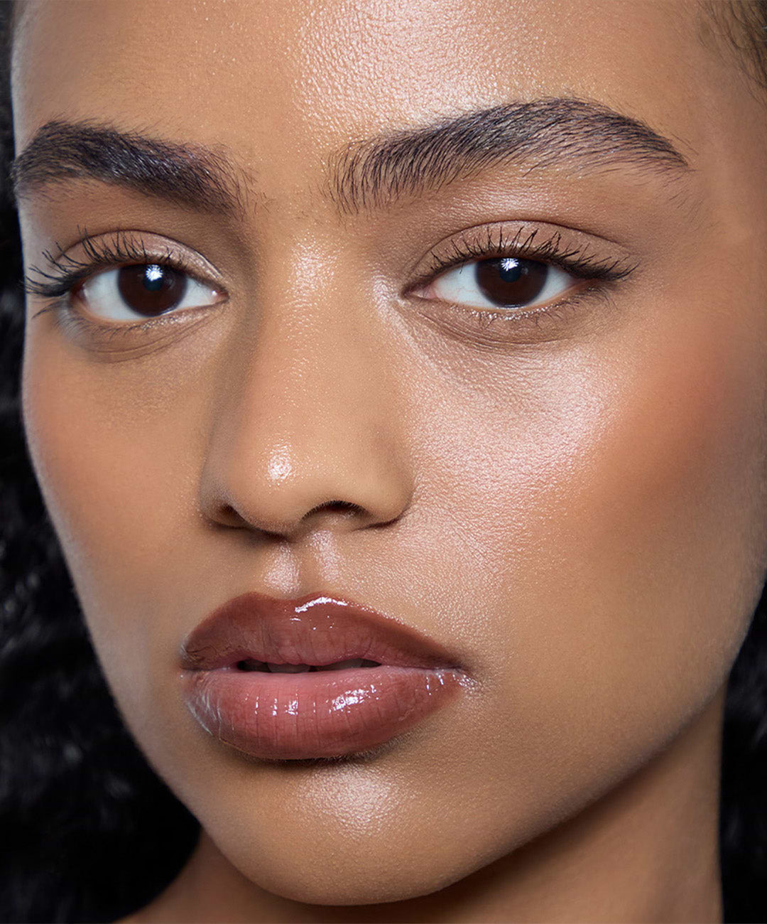 | desc: Manar wears Lip Sculpt + Lip Gloss in Suede