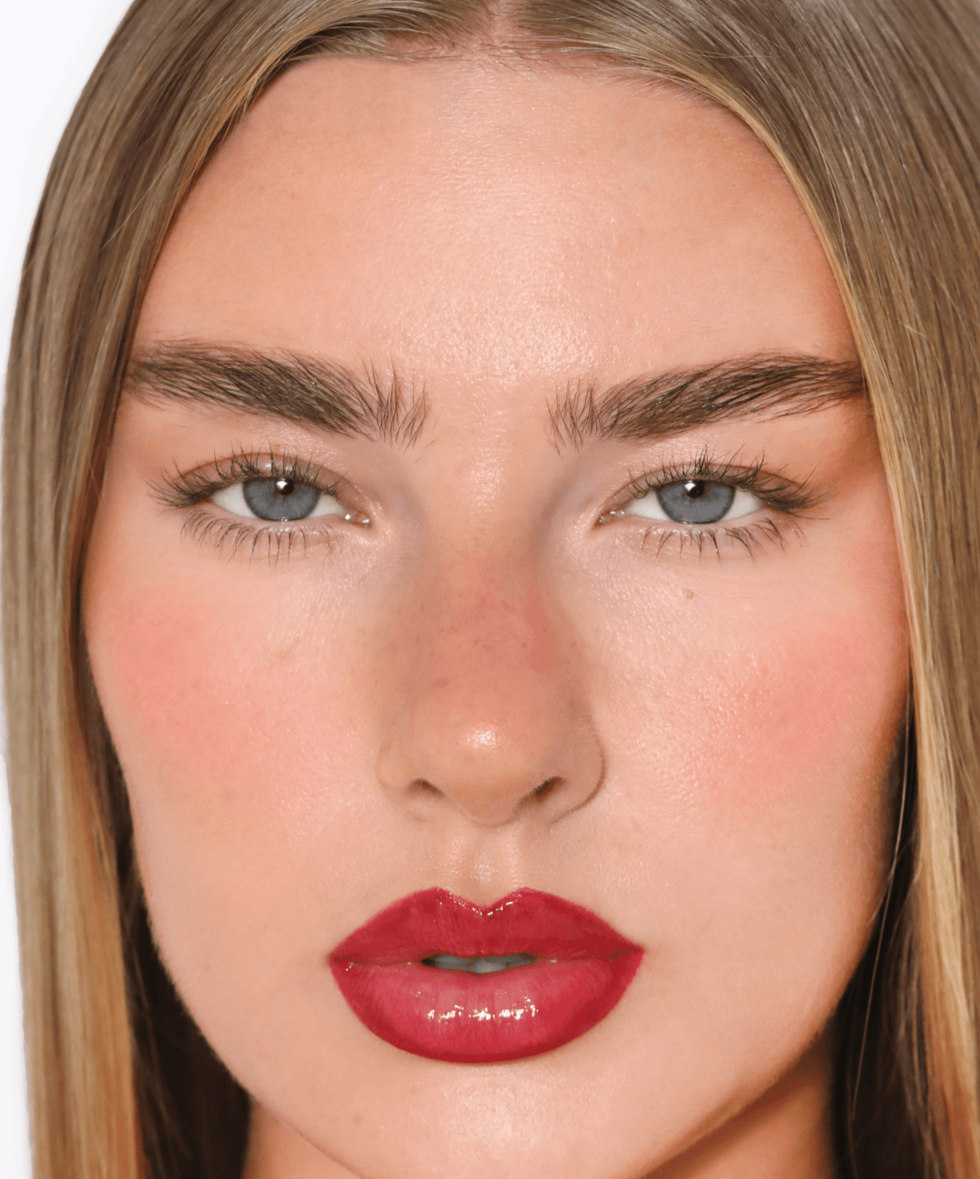 | desc: | text: light Jess wears Lip Gloss in shade Red