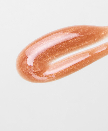 swatch of the REFY lip gloss in shade topaz