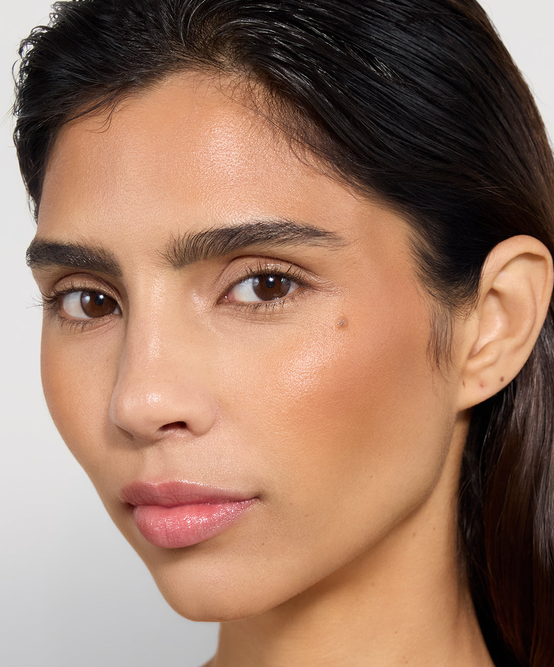 | desc: Desi wears shade Tan
