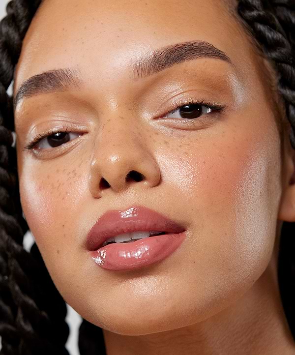 | desc: Model wears Lip Sculpt & Lip Gloss in Rosewood