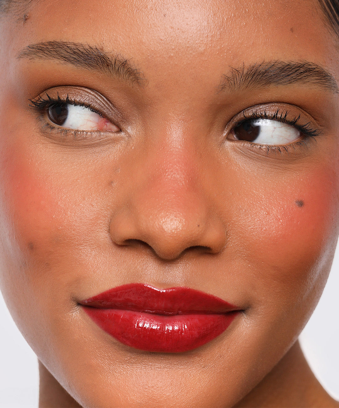 | desc: Model wears Lip Sculpt in shade Red