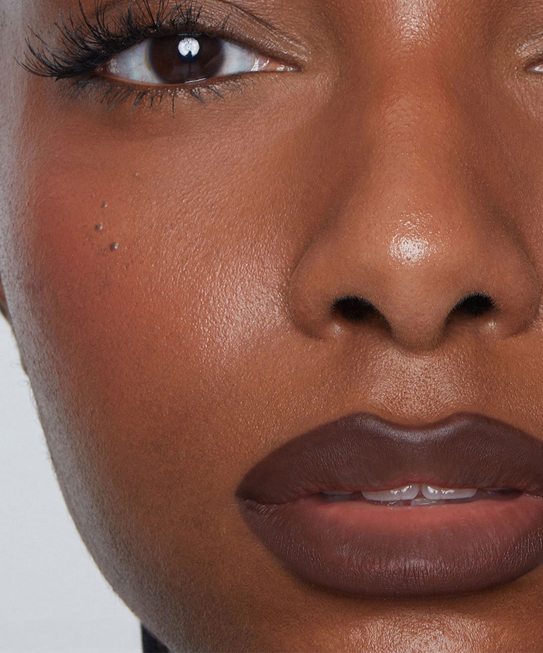 | desc: Model wears Lip Sculpt in shade Sepia 