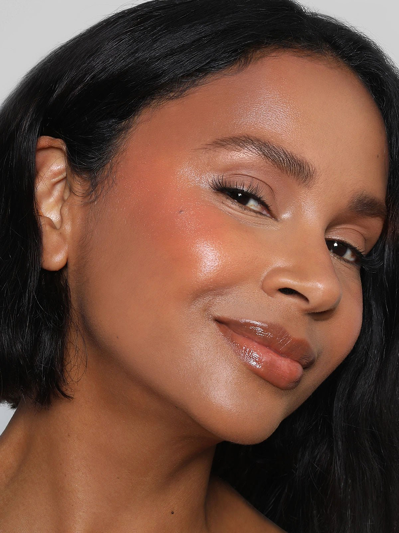 REFY CREAM BLUSH IN SHADE PEACH ON MODEL