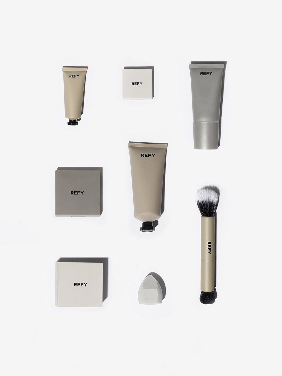 FRONT IMAGE OF REFY FACE & BODY SET. CONTAINS GLOSS HIGHLIGHTER, CREAM BLUSH, FACE PRIMER, CREAM BRONZER, BODY GLOW, SKIN FINISH, BEAUTY SPONGE AND DUO BRUSH