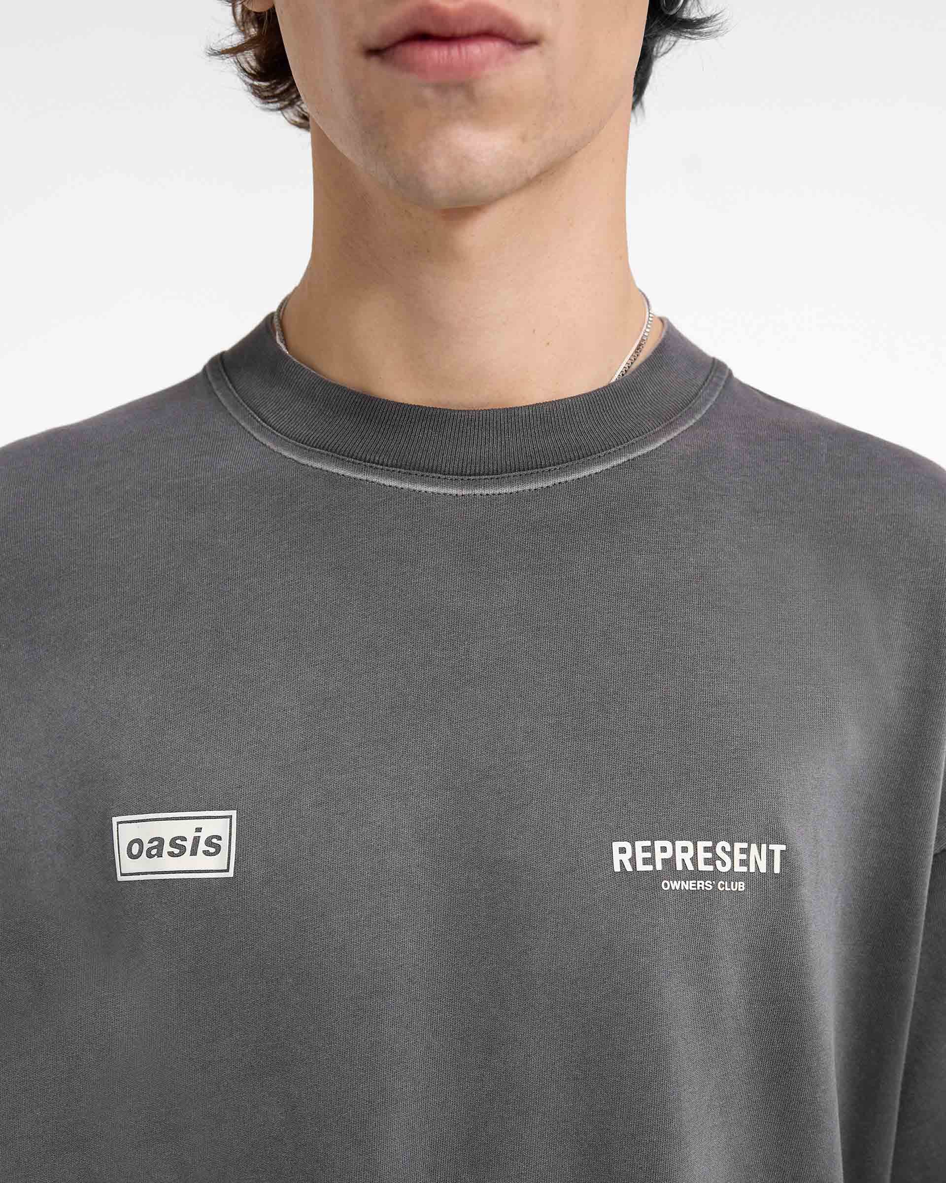 Represent X Oasis Owners Club T-Shirt | Stained Black | REPRESENT