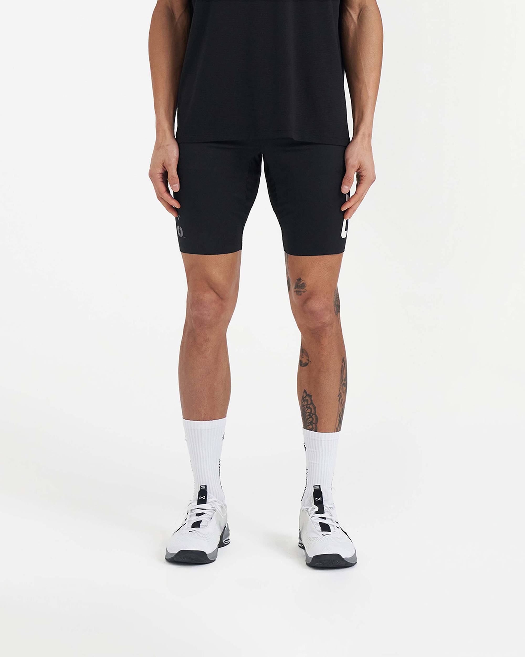 Back product image of mens black base layer shorts on a plain white background | Team 247 Half Tight x Marchon in Black | Base layer shorts with breathable fabric | 247 Shorts | Represent Clo
