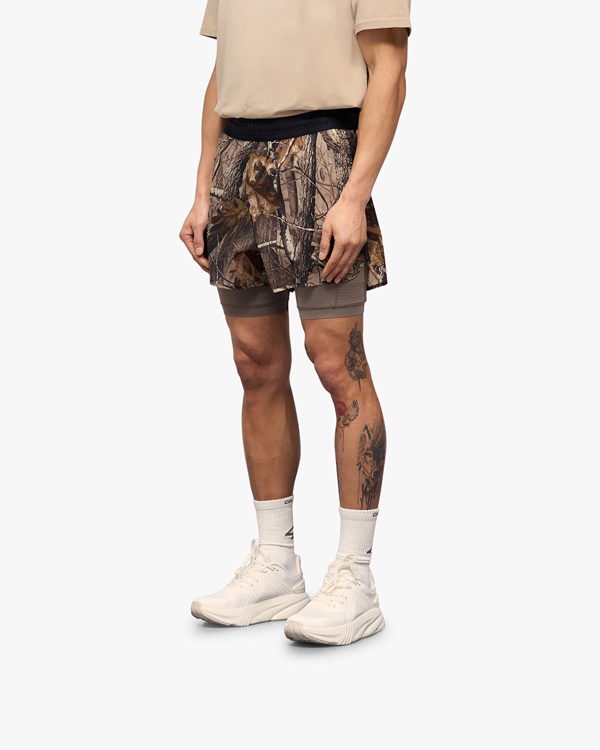 Back product image of mens camouflage shorts on a plain white background | 247 Contour 2-In-1 Run Shorts in Realtree | 2-in-1 shorts with inner legging and zip pockets | 247 Shorts | Represent Clo