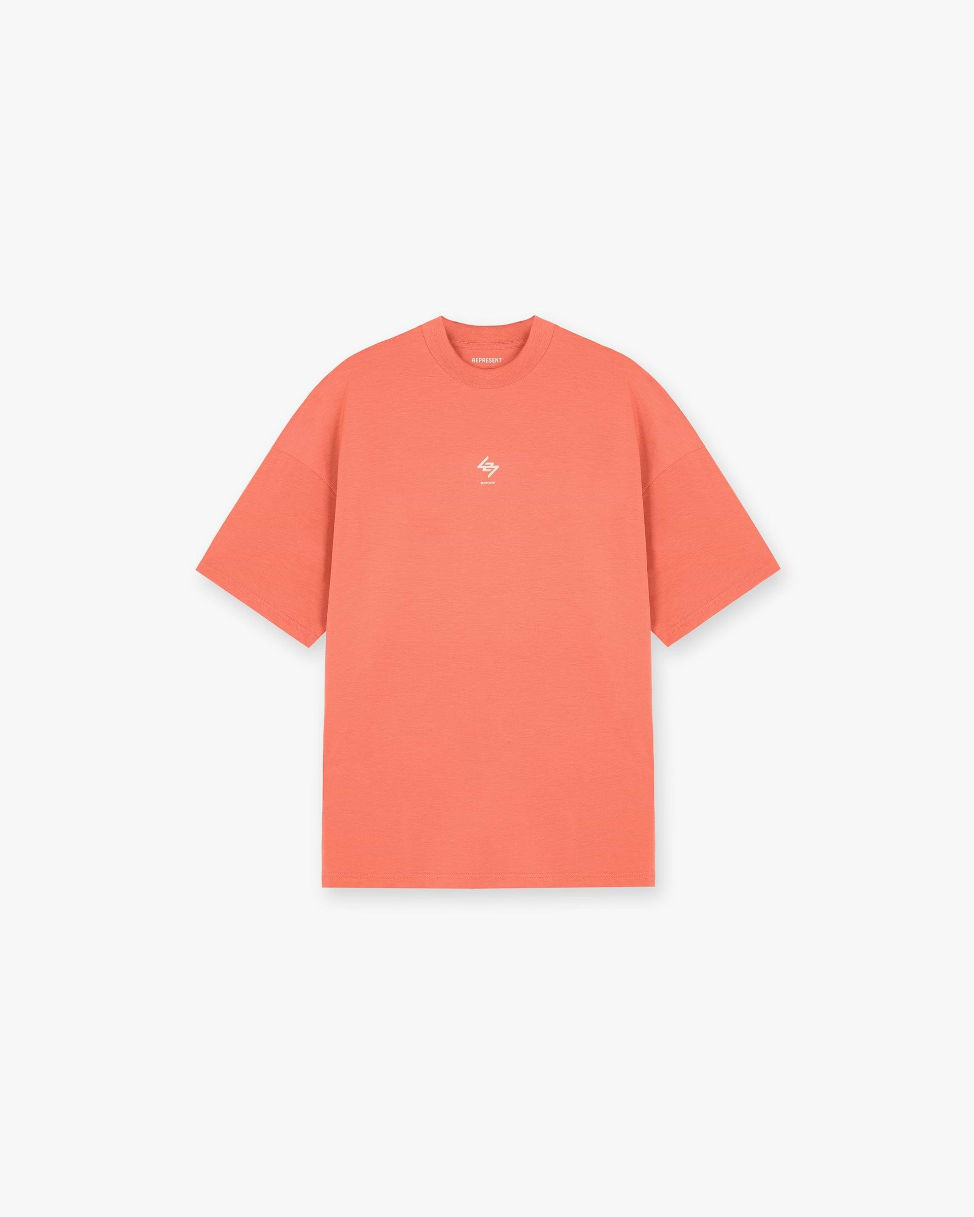 Front product image of a kids coral t-shirt on a plain white background | 247 Oversized T-Shirt in Coral | Slightly oversized t-shirt with screen printed graphic | 247 T-Shirts | Represent Clo