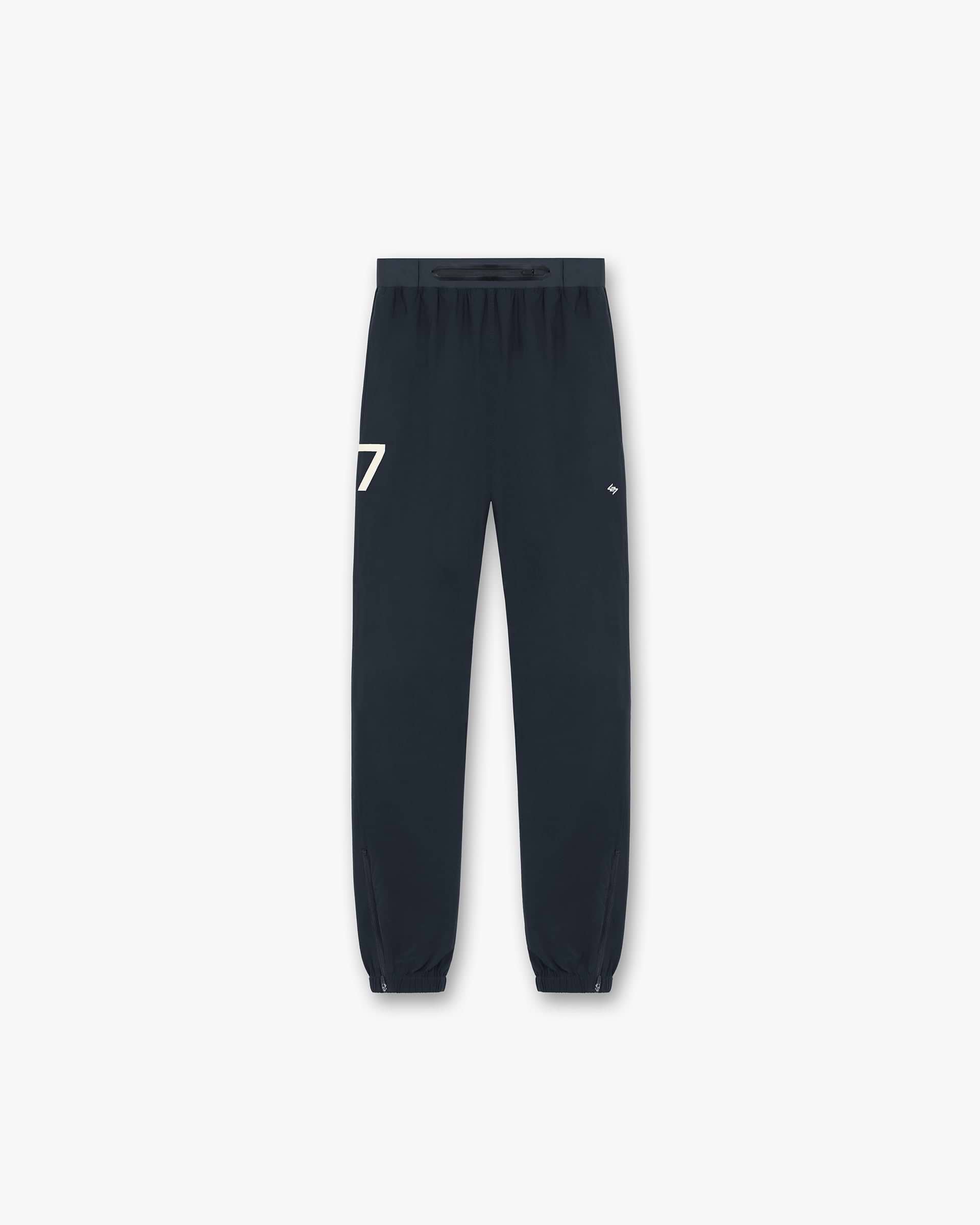 Back product image of mens navy pants on a plain white background | 247 Training Pant in Navy | Pants with elasticated waistband and zip cuffs | 247 Pants | Represent Clo