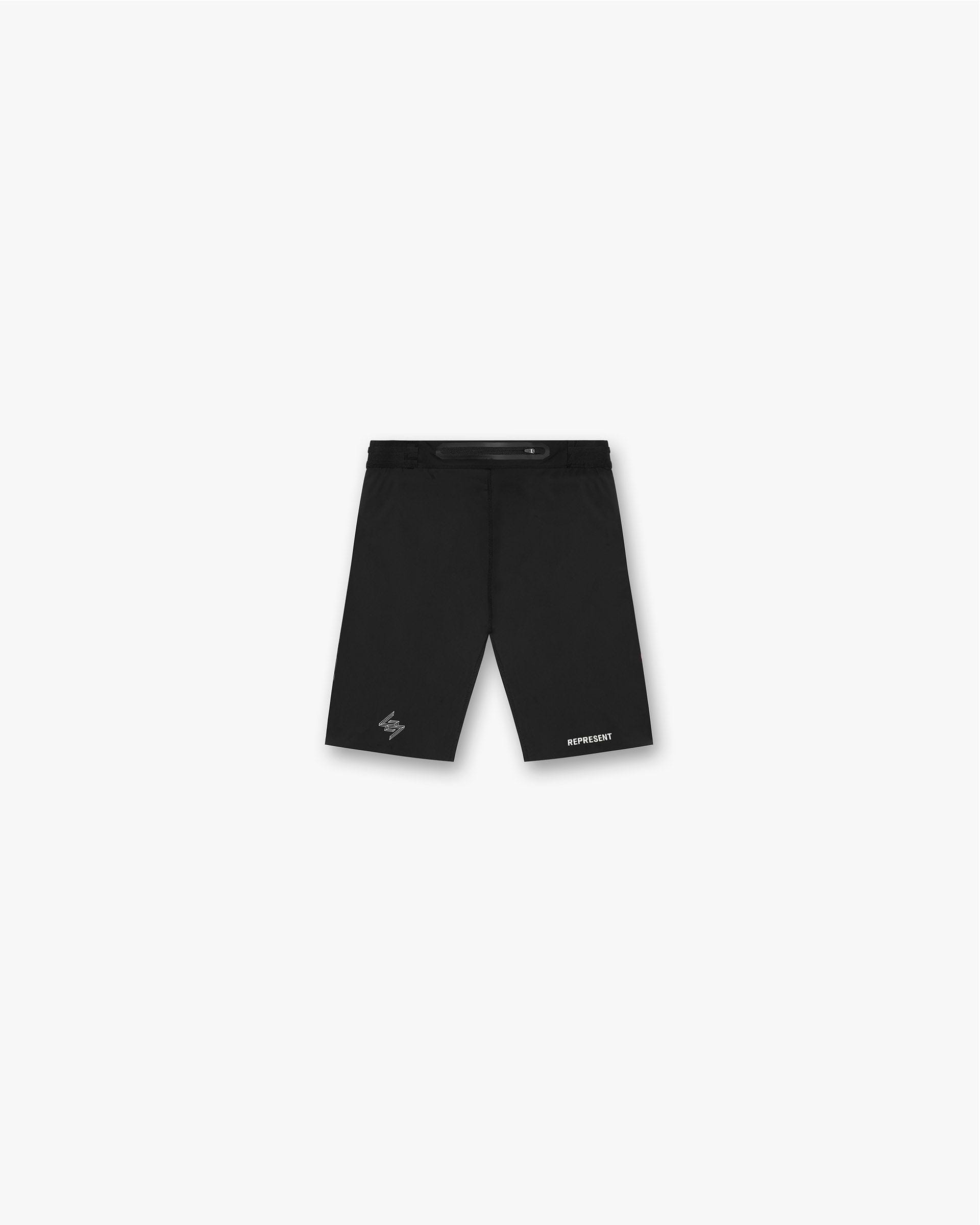 Back product image of mens black running half tights on a plain white background | 247 Berlin Half Tight in Jet Black | Running shorts with 4-way stretch fabric | 247 Shorts | Represent Clo