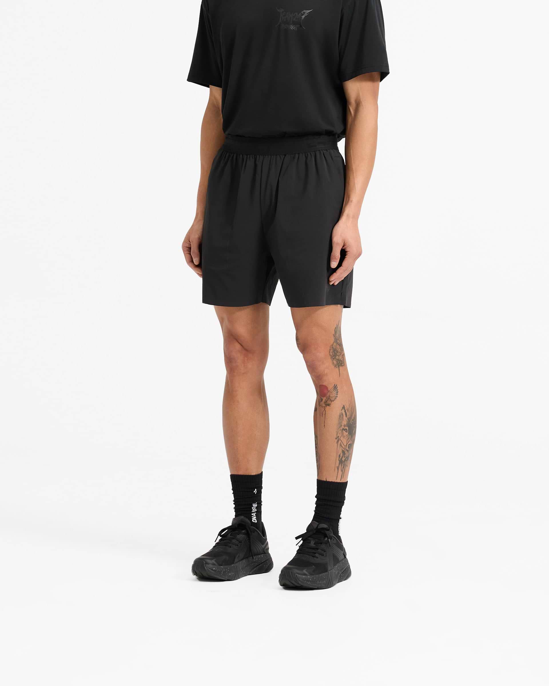Man wearing black shorts on a plain white background | Team 247 X END Fused Short in Jet Black | Performance shorts with 4-way stretch and quick-drying fabric | 247 Shorts | Represent Clo