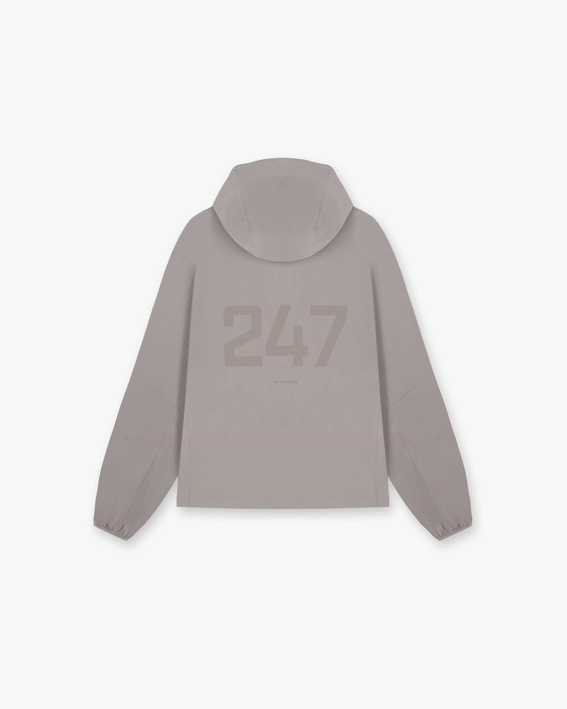 Back product image of a mens grey hooded training jacket on a plain white background | 247 Hooded Training Jacket in Cinder | Nylon jacket with DWR coating and adjustable hem | 247 Outerwear | Represent Clo