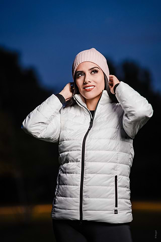 Woman wears Heat Holders® Puffer Jacket and thermal hat.