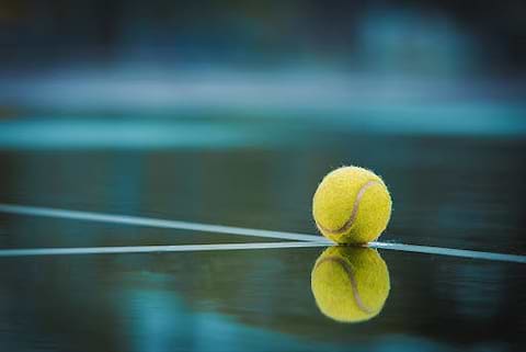 tennis ball on a rainy court