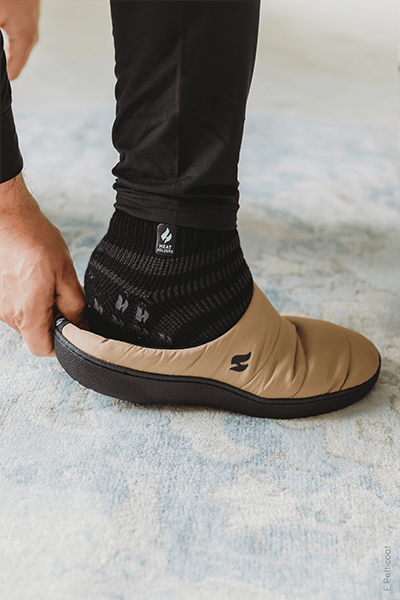 Person wears Heat Holders® ankle socks and slippers.