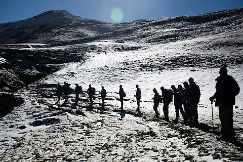 a group of hikers on a mountain in winter. | Heat Holders®