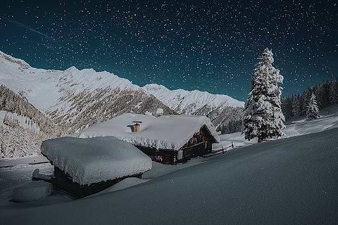 Cabin covered in snow