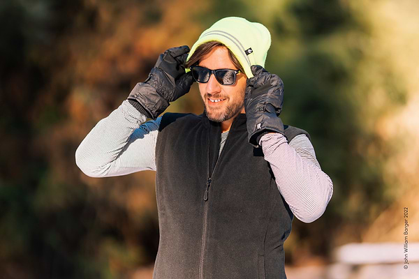 Man wearing Heat Holders® vest, hat, and gloves.