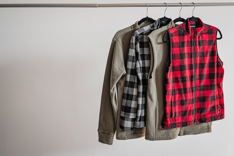 Heat Holders® vests and jackets hanging up