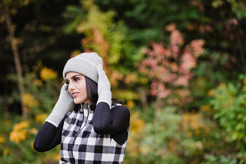 Woman wearing Heat Holders® zip vest and Heat Holders® thermal beanie and gloves.