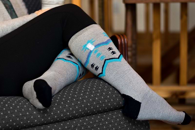 Woman wearing Heat Holders® long socks.