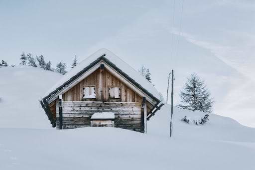 Cabin in on a hill in winter. Heat Holders® Men's Thermal hats