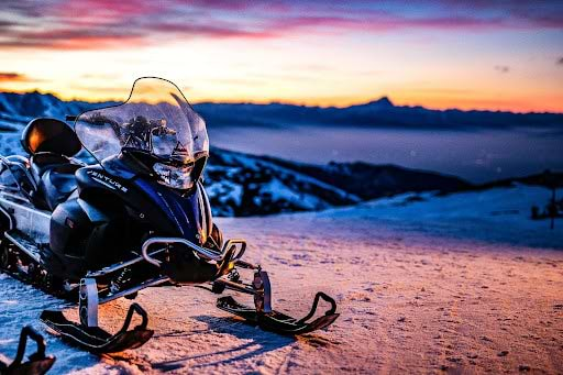 Snow mobile on snow laden landscape