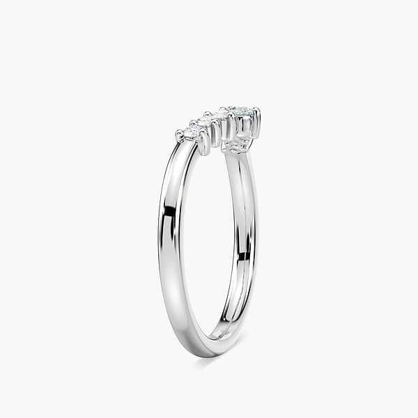 The Cordelia Wedding Band has a .21ctw half halo of round cut recycled diamonds that get larger in size as they meet in the middle of the recycled 14K white gold band | Cordelia wedding band recycled diamonds 14K white gold