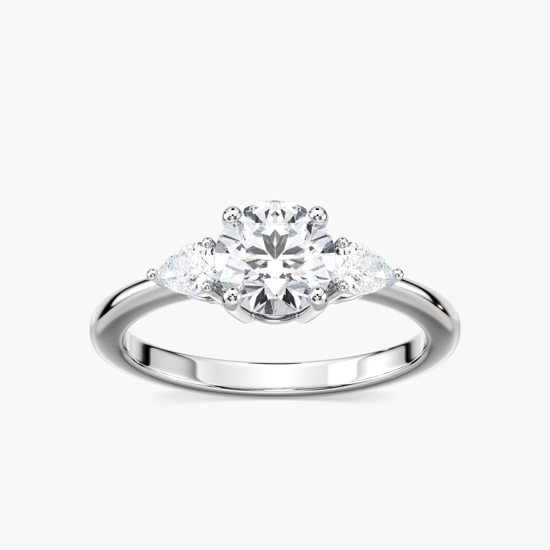 Shown with 2ct Lab Grown Champagne Pink Sapphire in 14k White Gold|Beautiful lab grown champagne pink sapphire engagement ring with pear cut side stones in 14k white gold